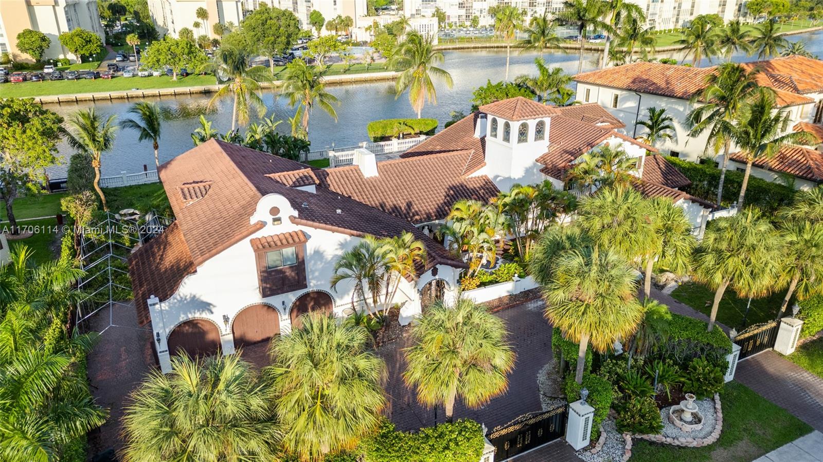 an aerial view of a house with outdoor space and a lake view