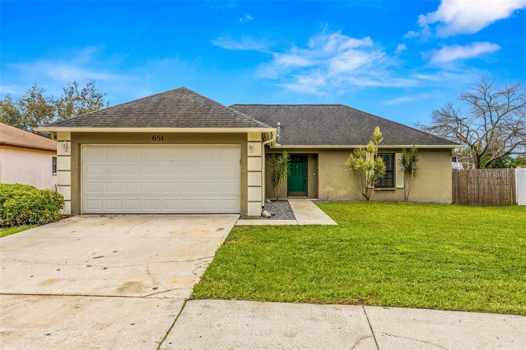 front view of a house with a yard