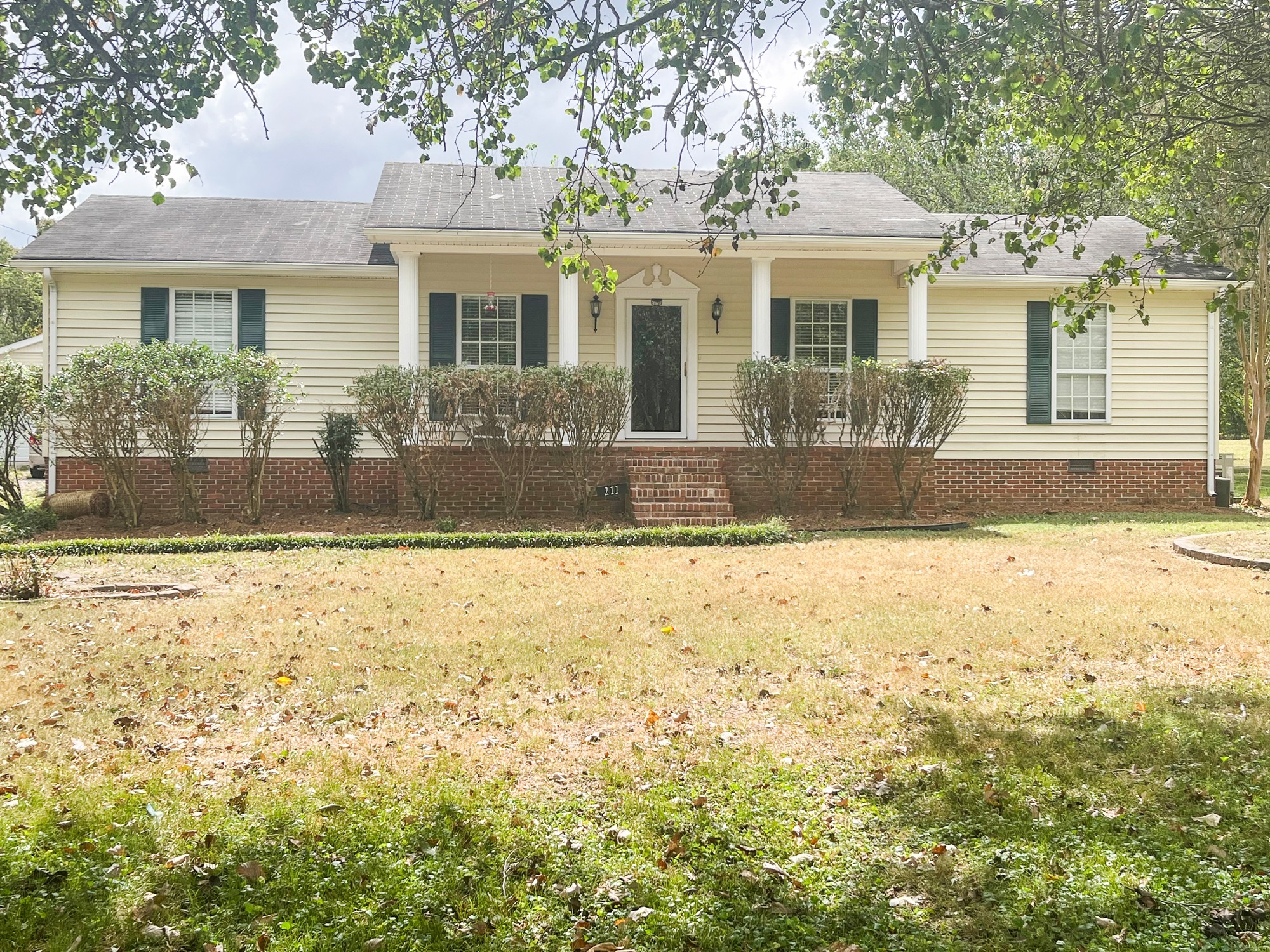 a front view of a house with a yard