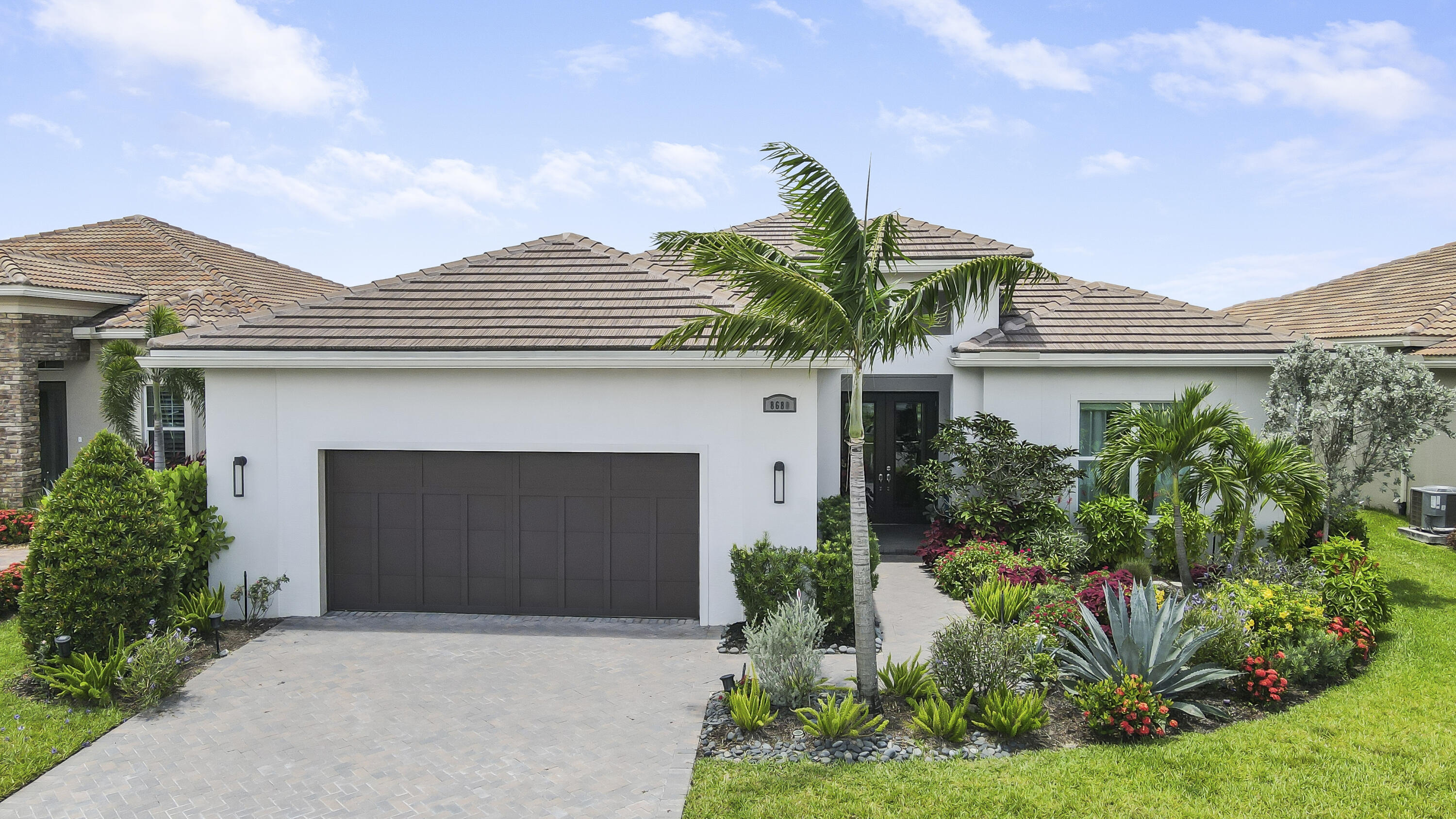 front view of a house with a garden