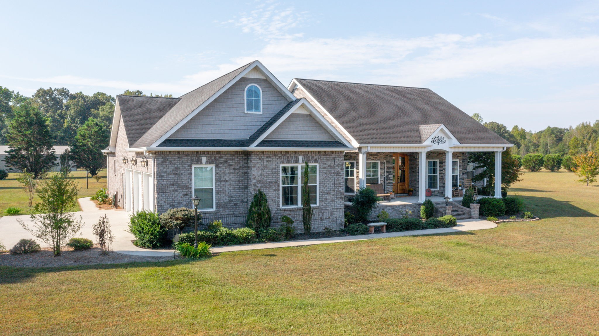 a front view of a house with garden