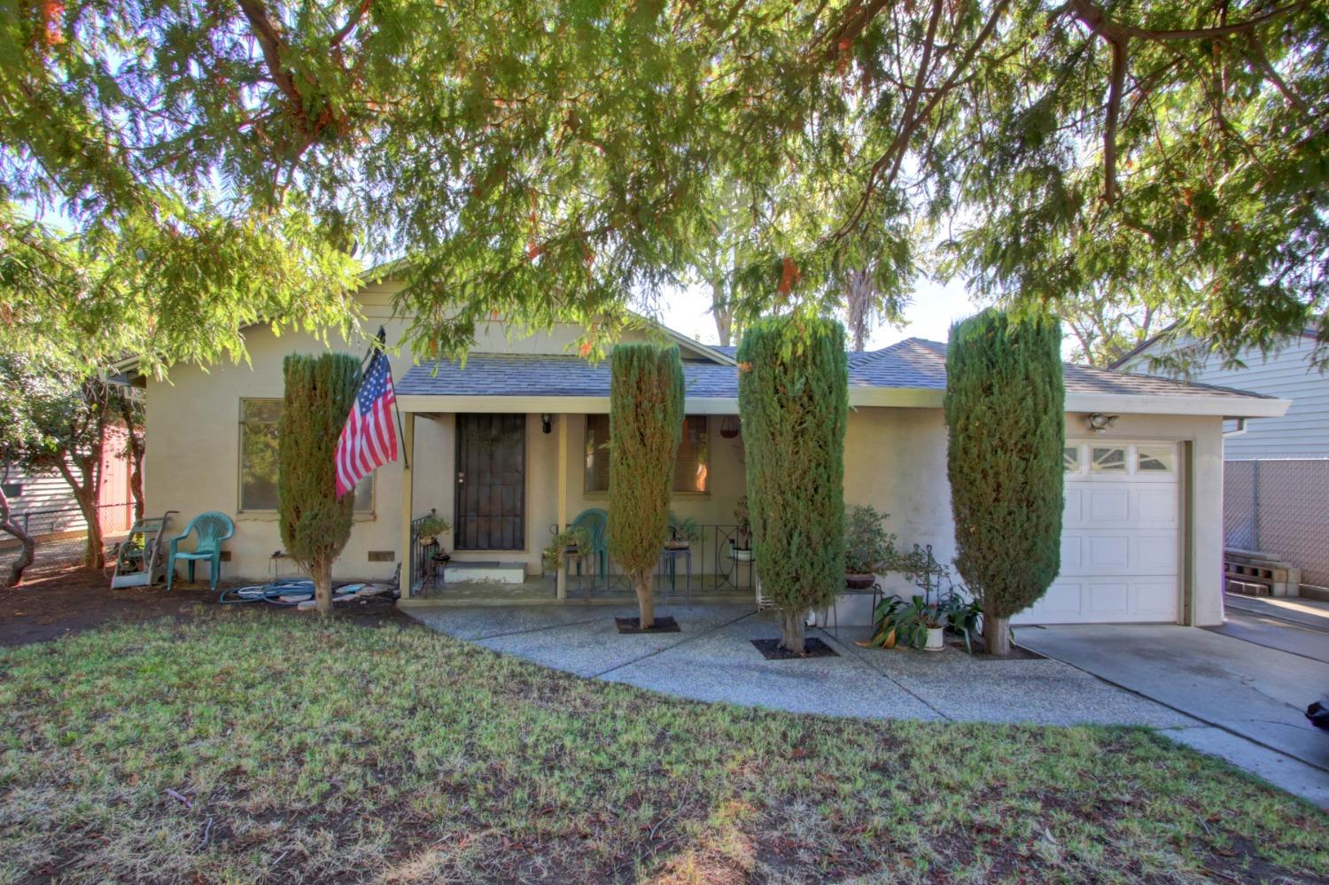 a front view of a house with garden