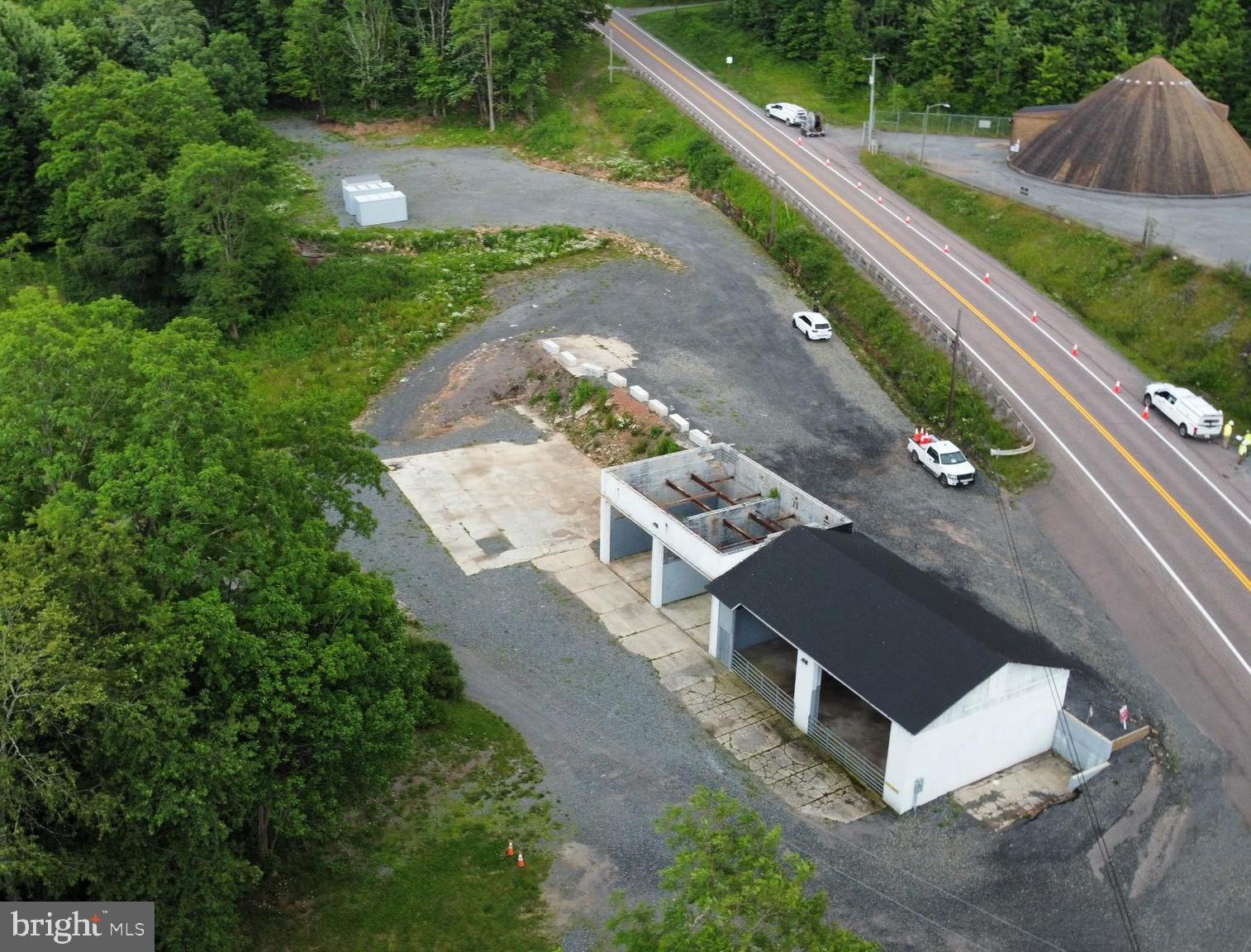 an aerial view of a house with a garden