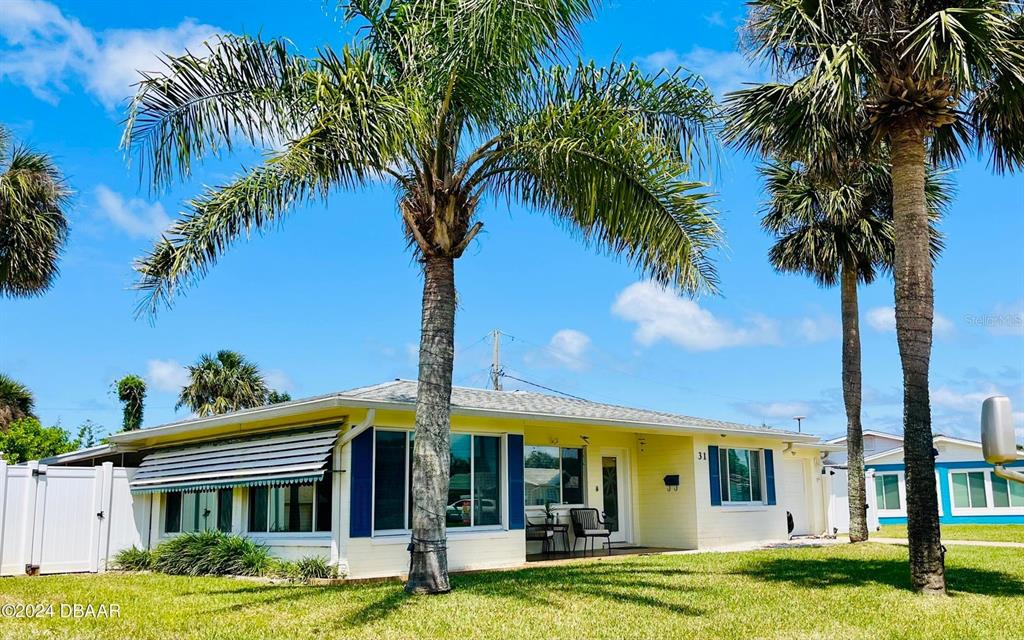 front view of a house with a yard