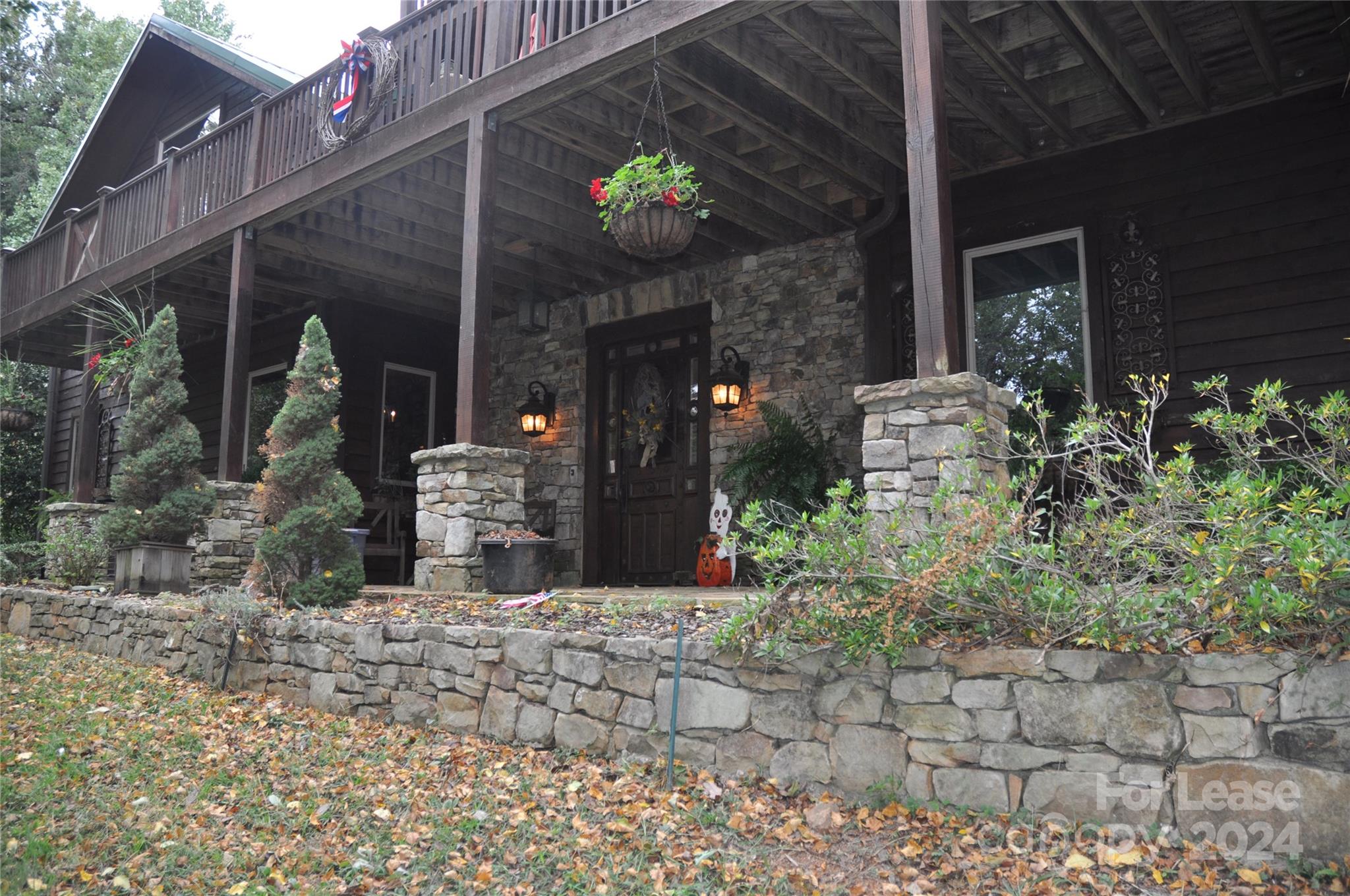 a view of a house with potted plants