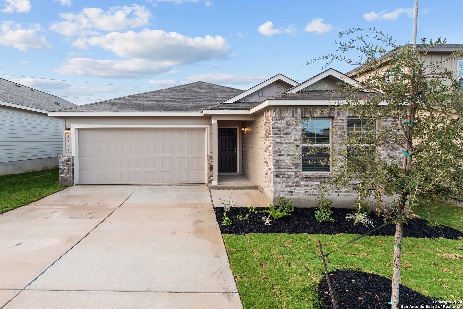 a front view of a house with a yard