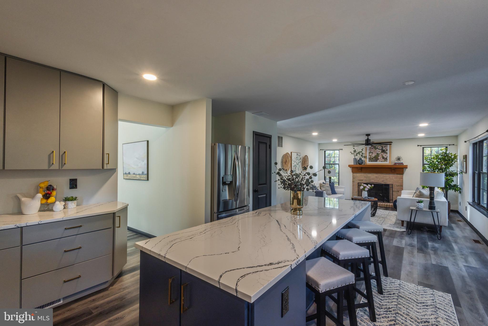 a large kitchen with a table and chairs