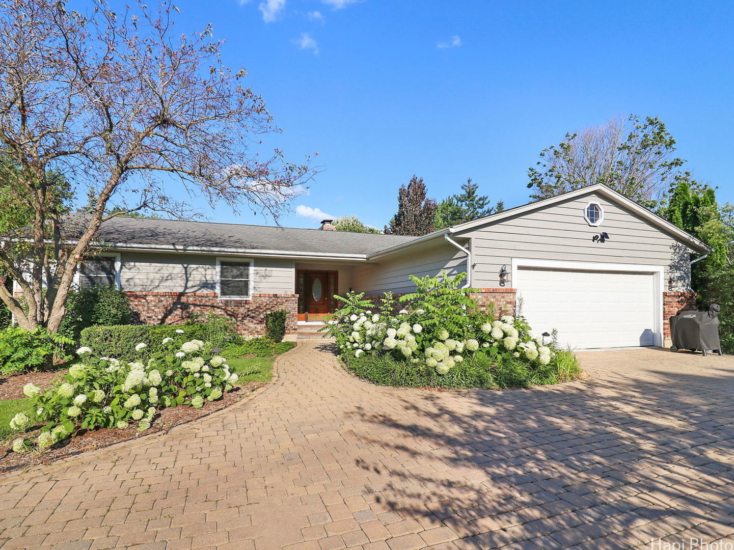 front view of a house with a yard