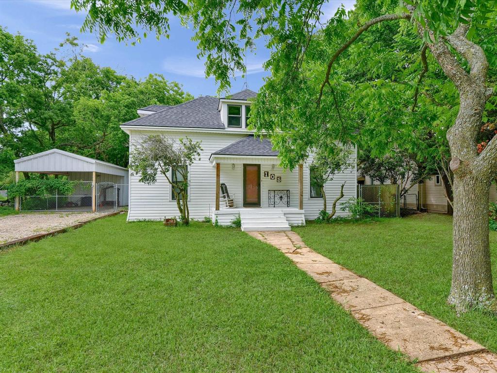 front view of a house with a yard