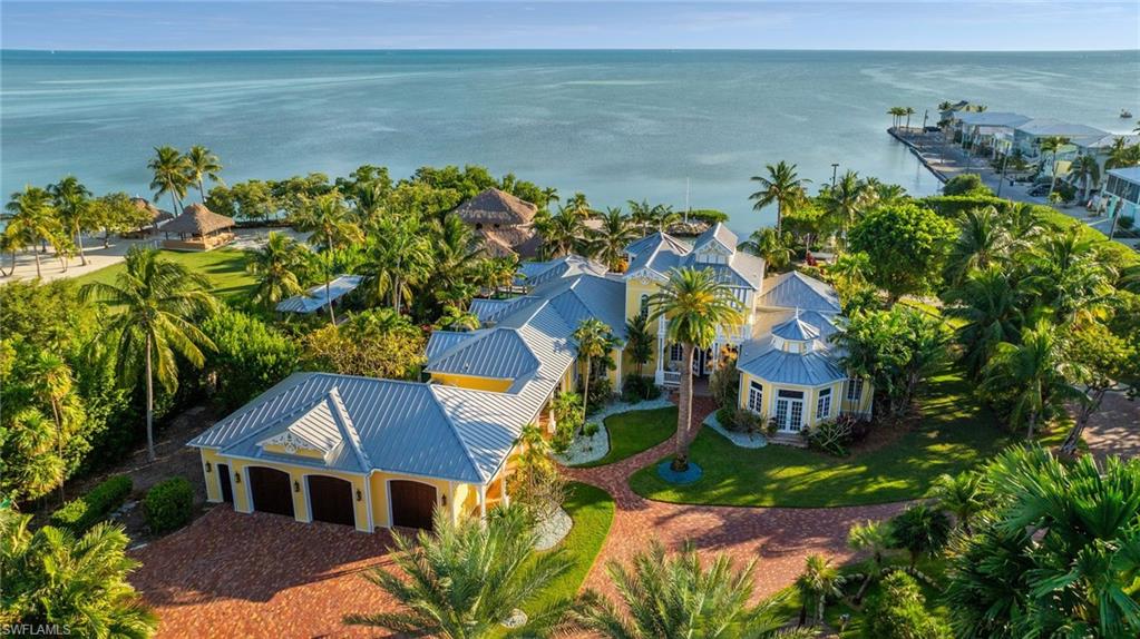 an aerial view of a house with a lake view