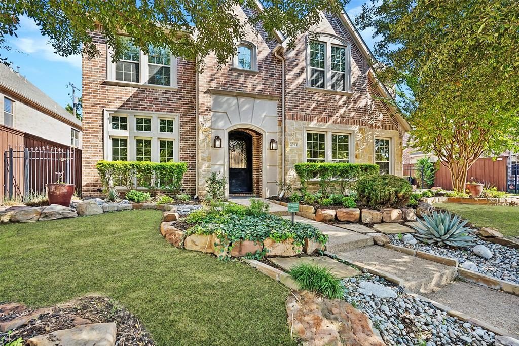 a front view of a house with swimming garden and patio