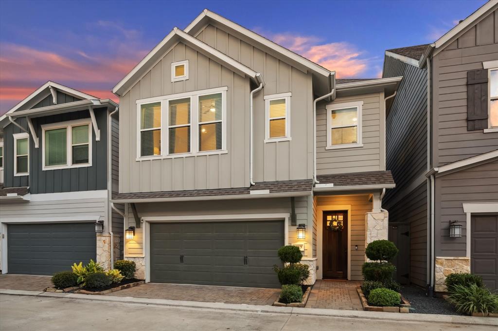 a front view of a house with garage