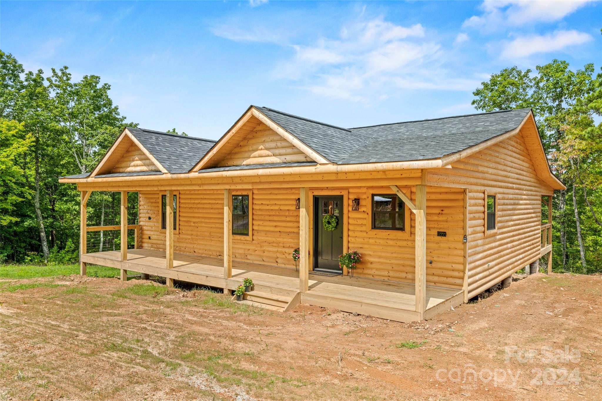 a view of a house with wooden fence