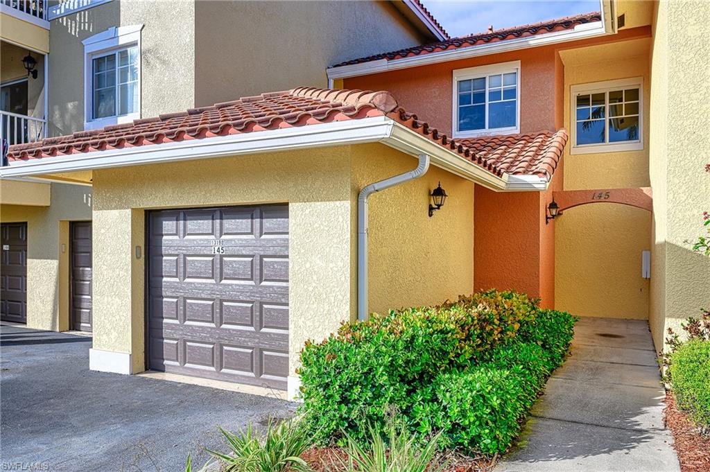 a front view of a house with a garage