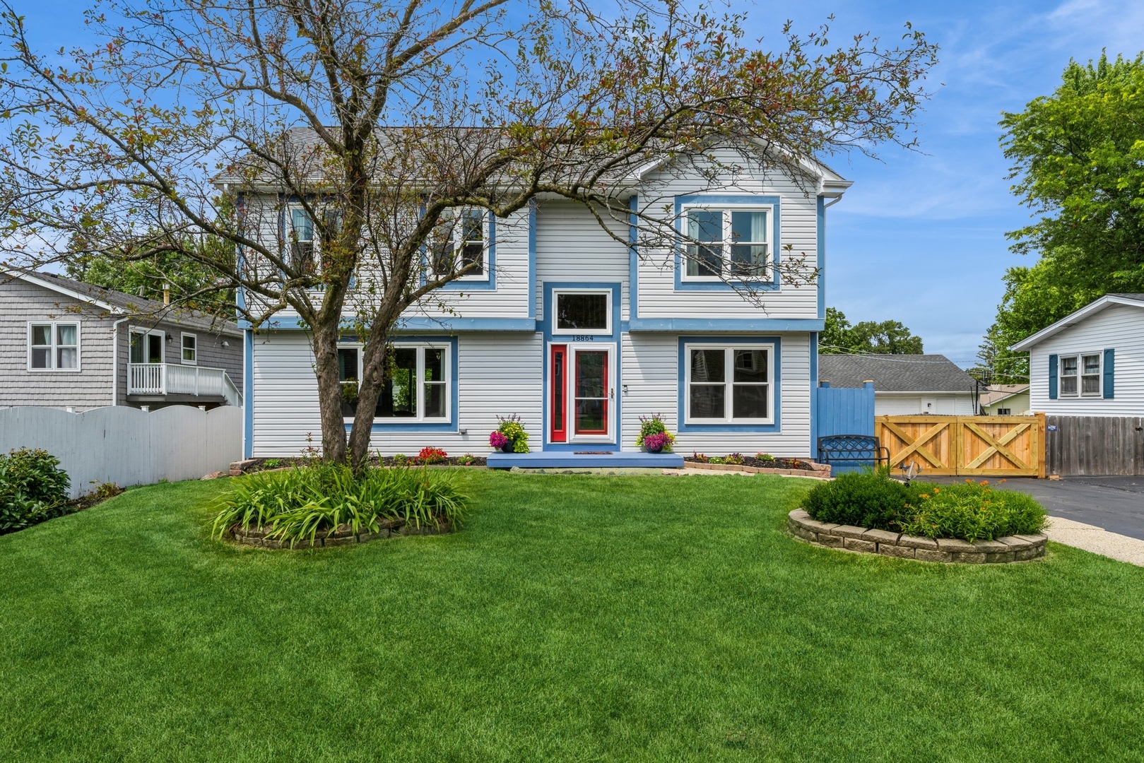 a front view of a house with a yard