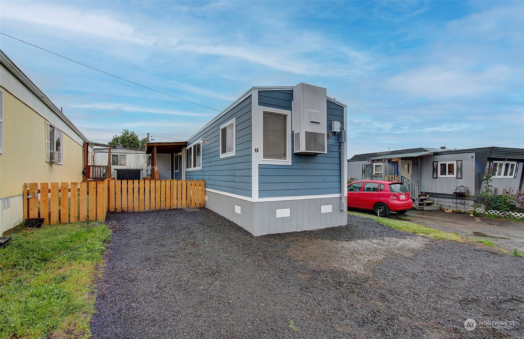 a view of a house with a yard and garage