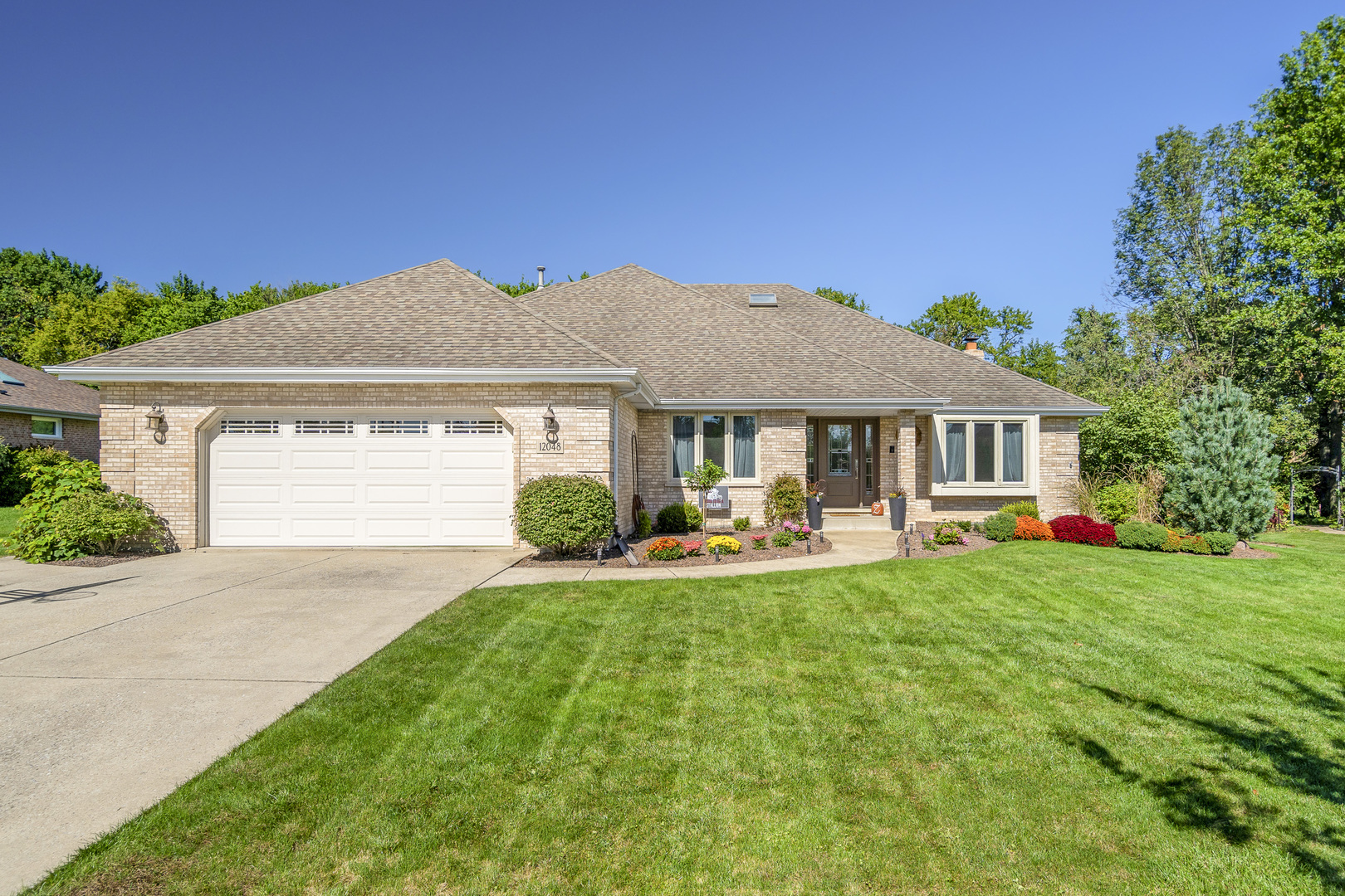 a front view of a house with swimming pool having outdoor seating