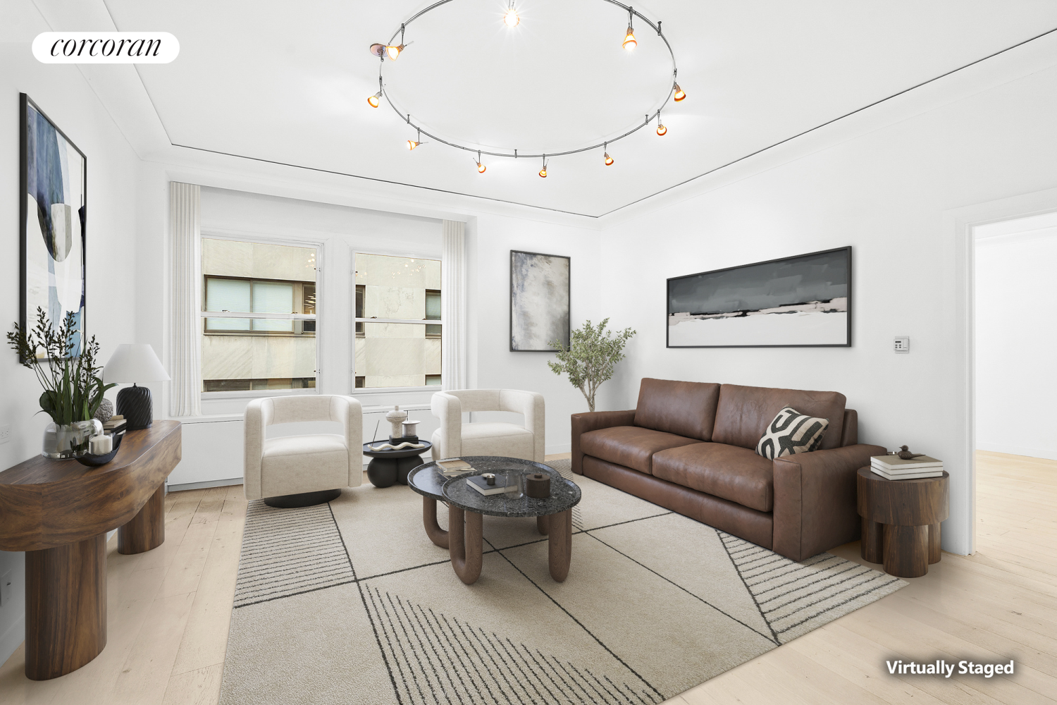 a living room with furniture and a potted plant