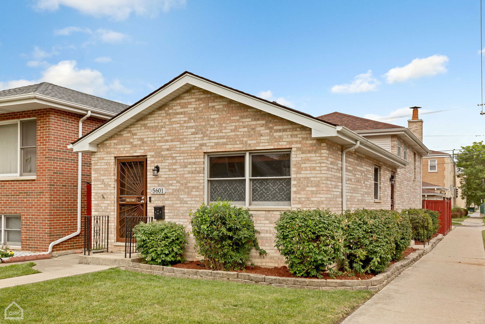 front view of a house with a yard