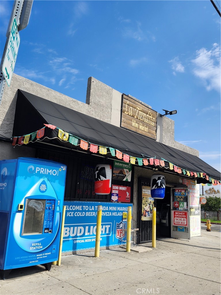 a view of a car park in front of retail shop