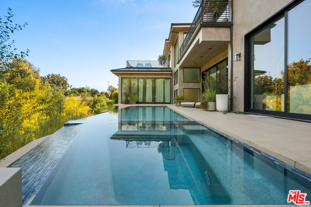 a view of a house with a swimming pool