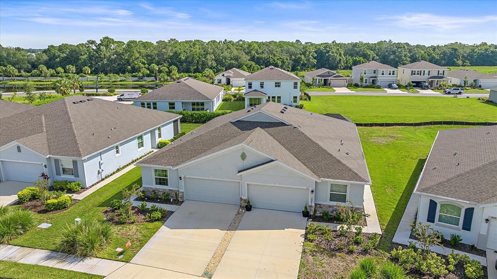 a aerial view of a house with a big yard