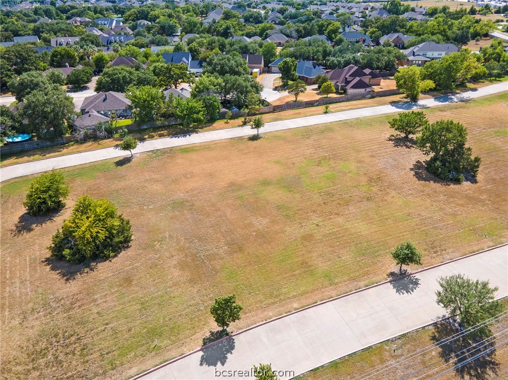 an aerial view of a swimming pool and outdoor space