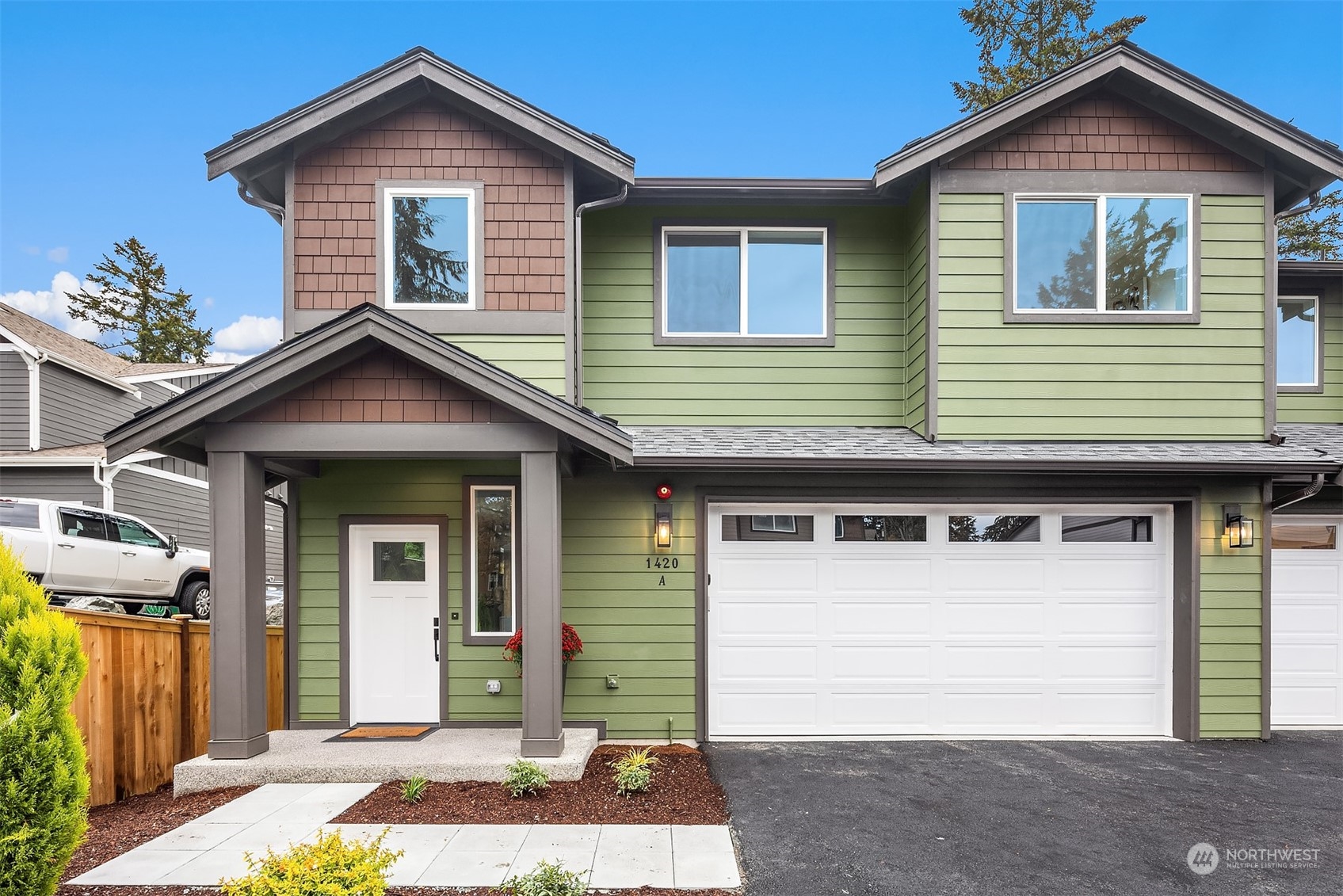 a front view of a house with a garage