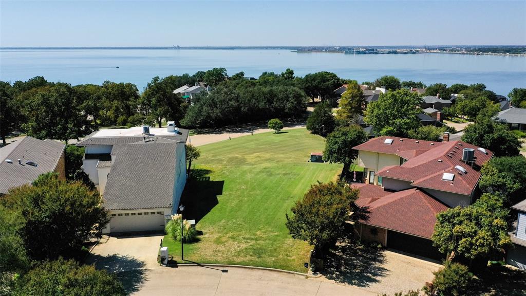 an aerial view of a house with a lake view