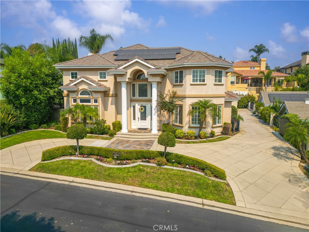 a front view of a house with swimming pool