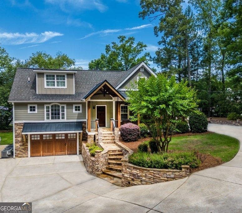 a front view of a house with garden