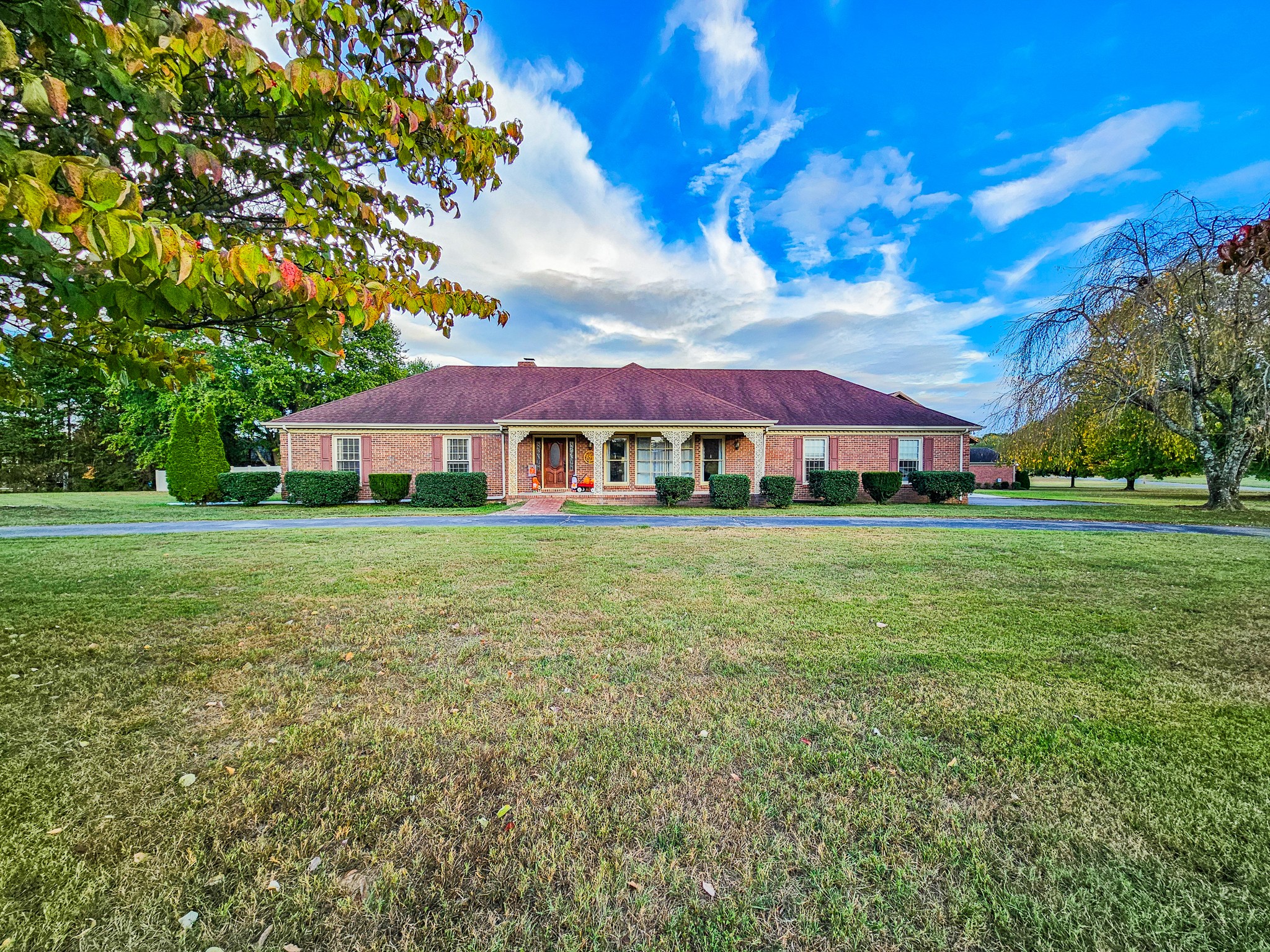 a front view of a house with garden