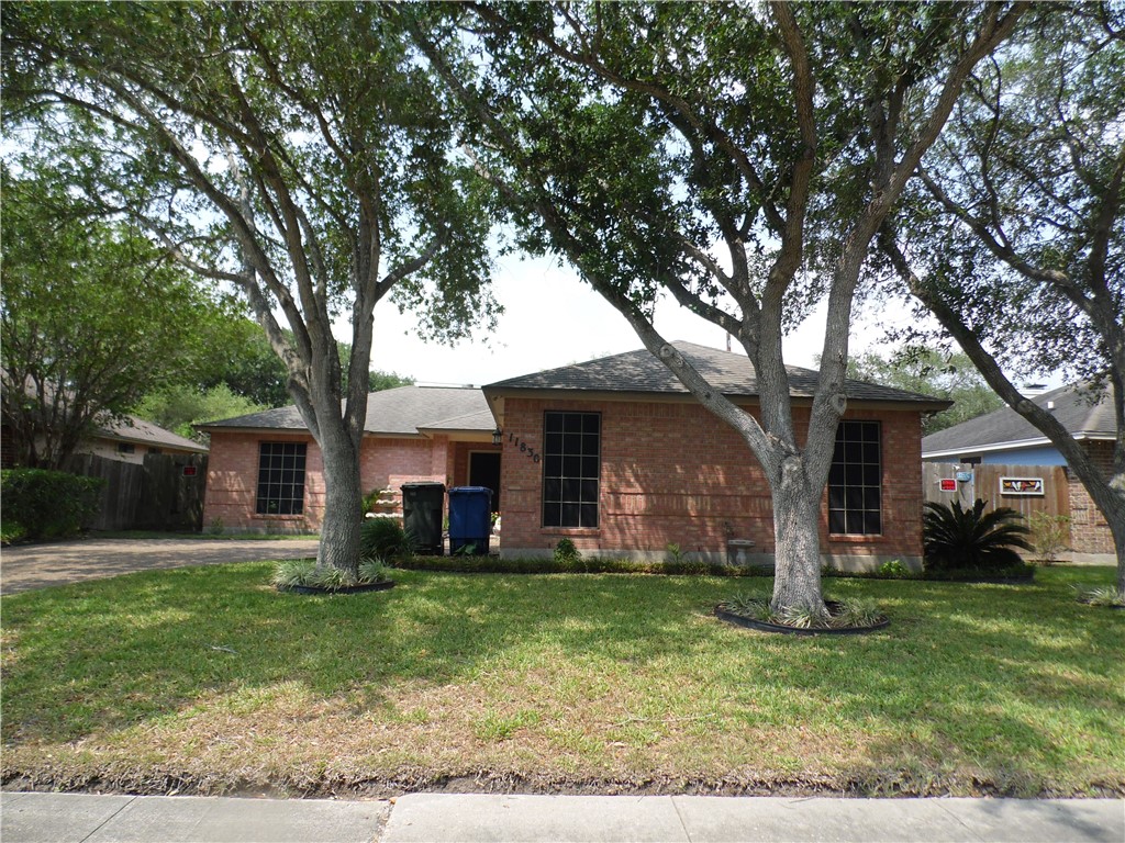 front view of a house with a yard