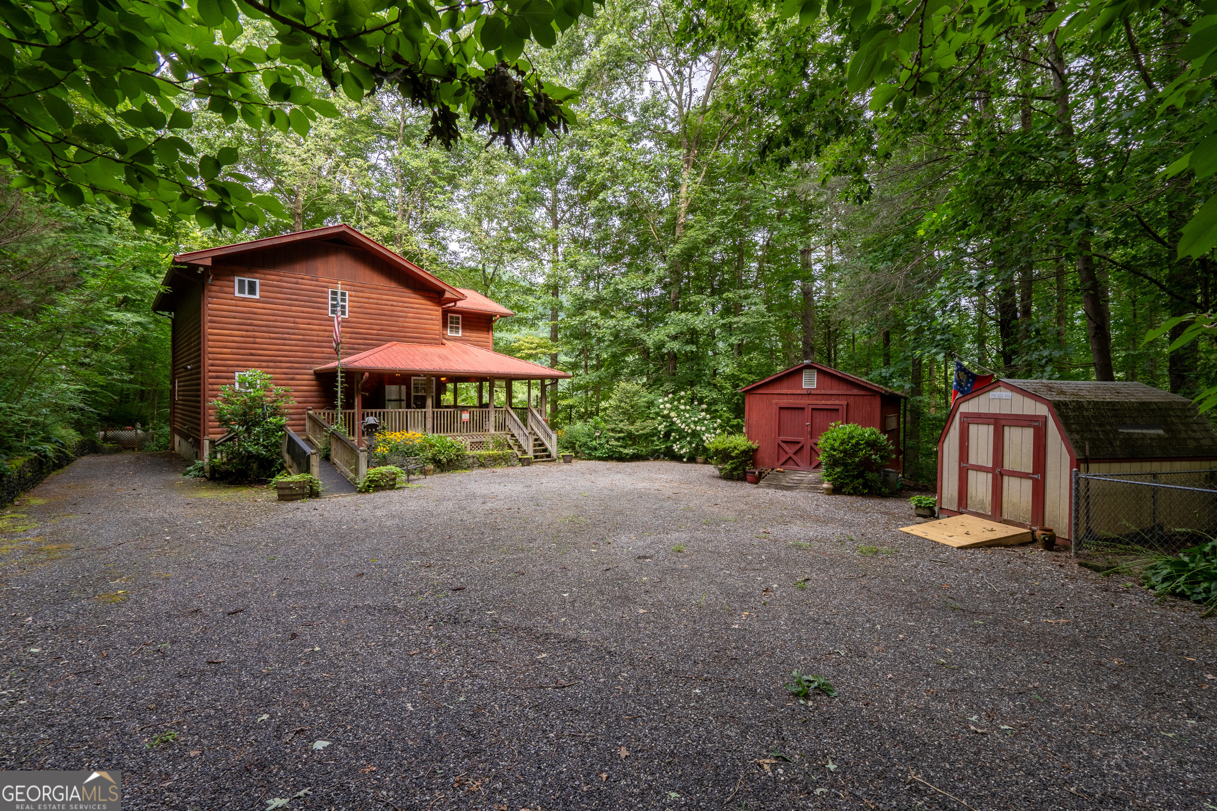 a front view of a house with yard and garage