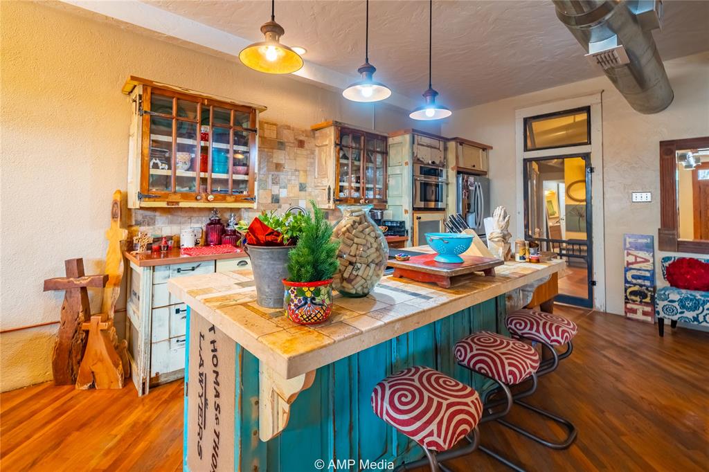 a view of kitchen and dining area with furniture