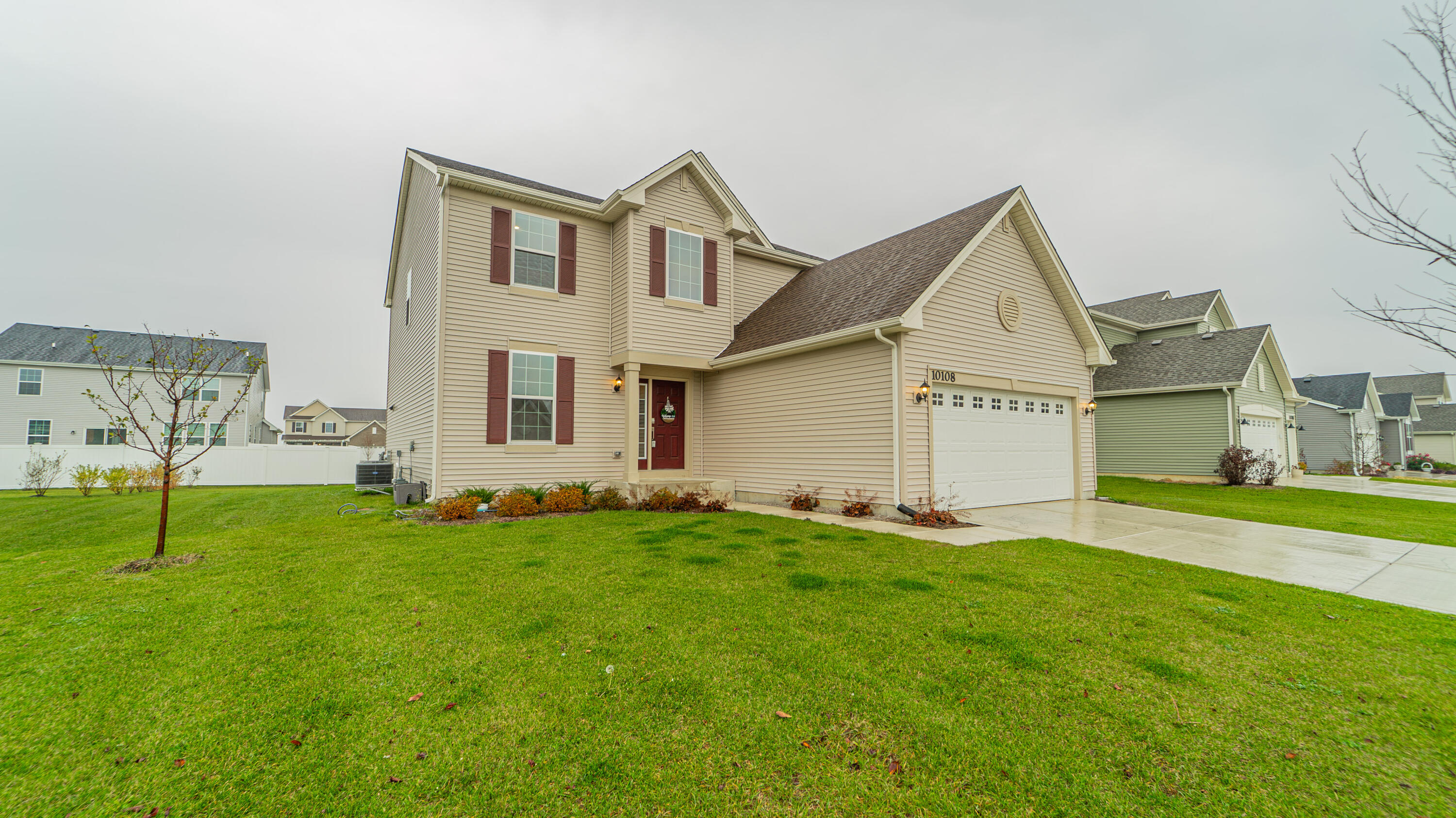 a front view of a house with a yard