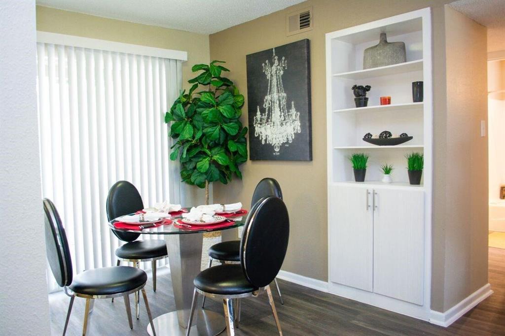 a view of a dining room with furniture and window