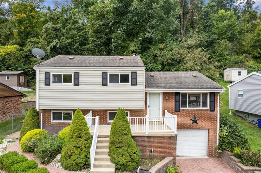 front view of a house with a yard