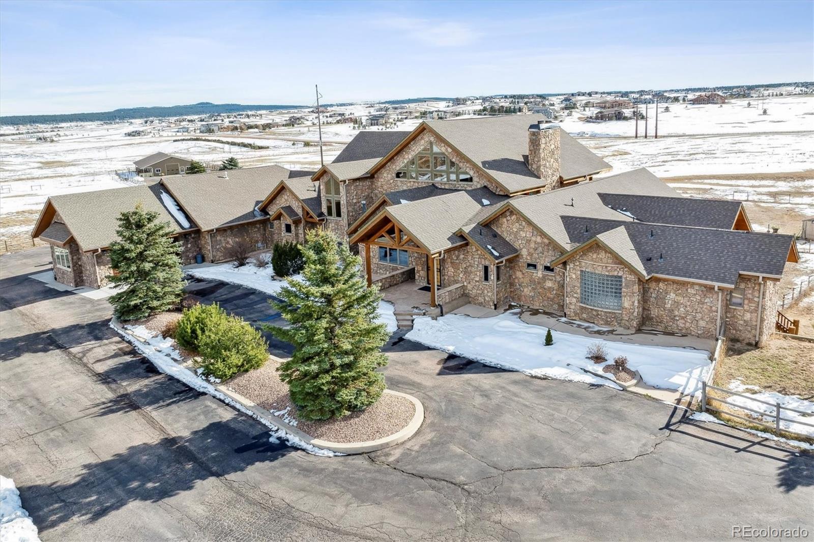 an aerial view of a building and outdoor space