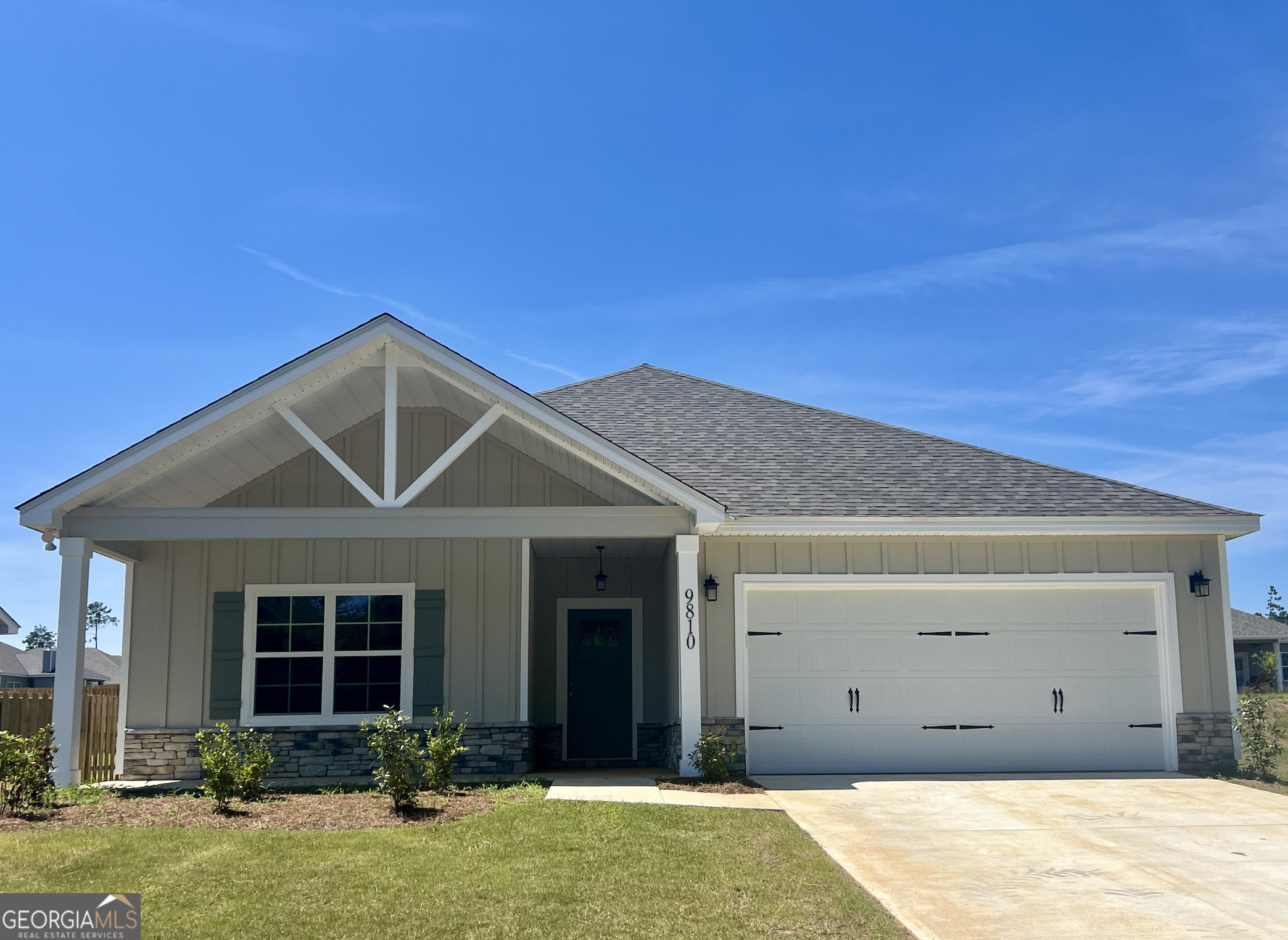 a house with yard in front of it