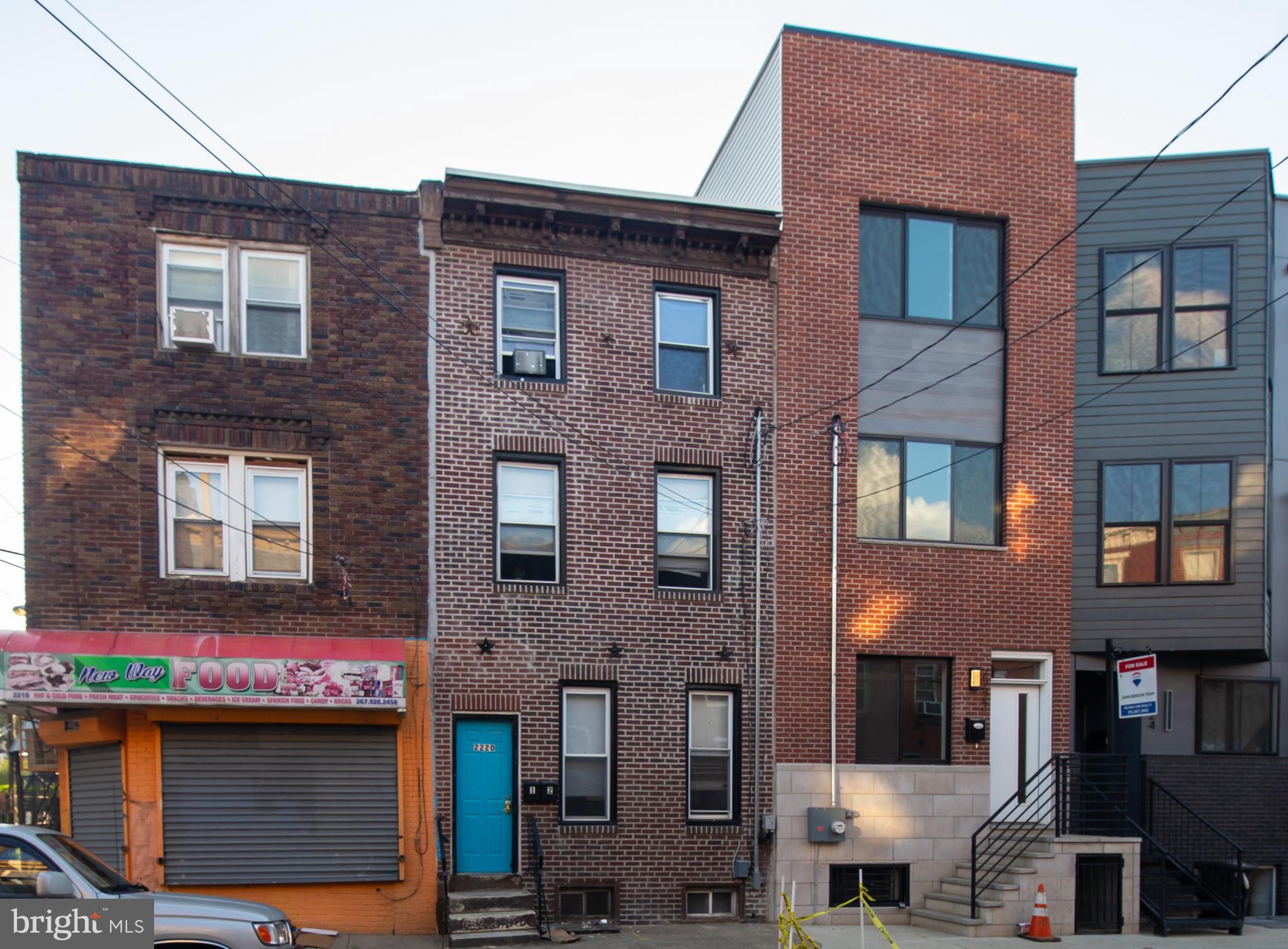 a view of building with a lot of windows and a refrigerator