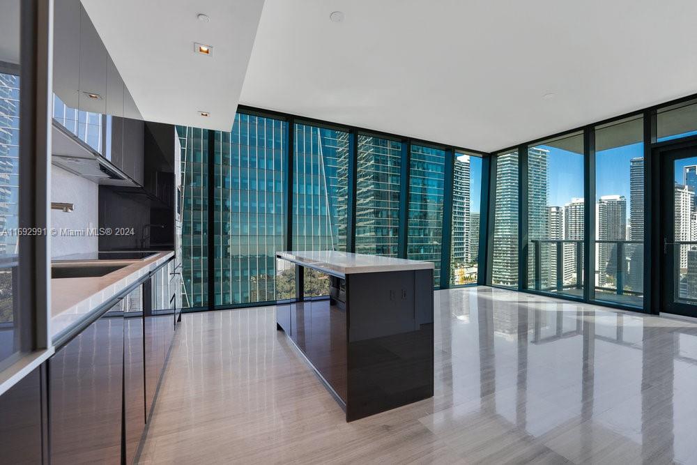 a view of a living room and a balcony