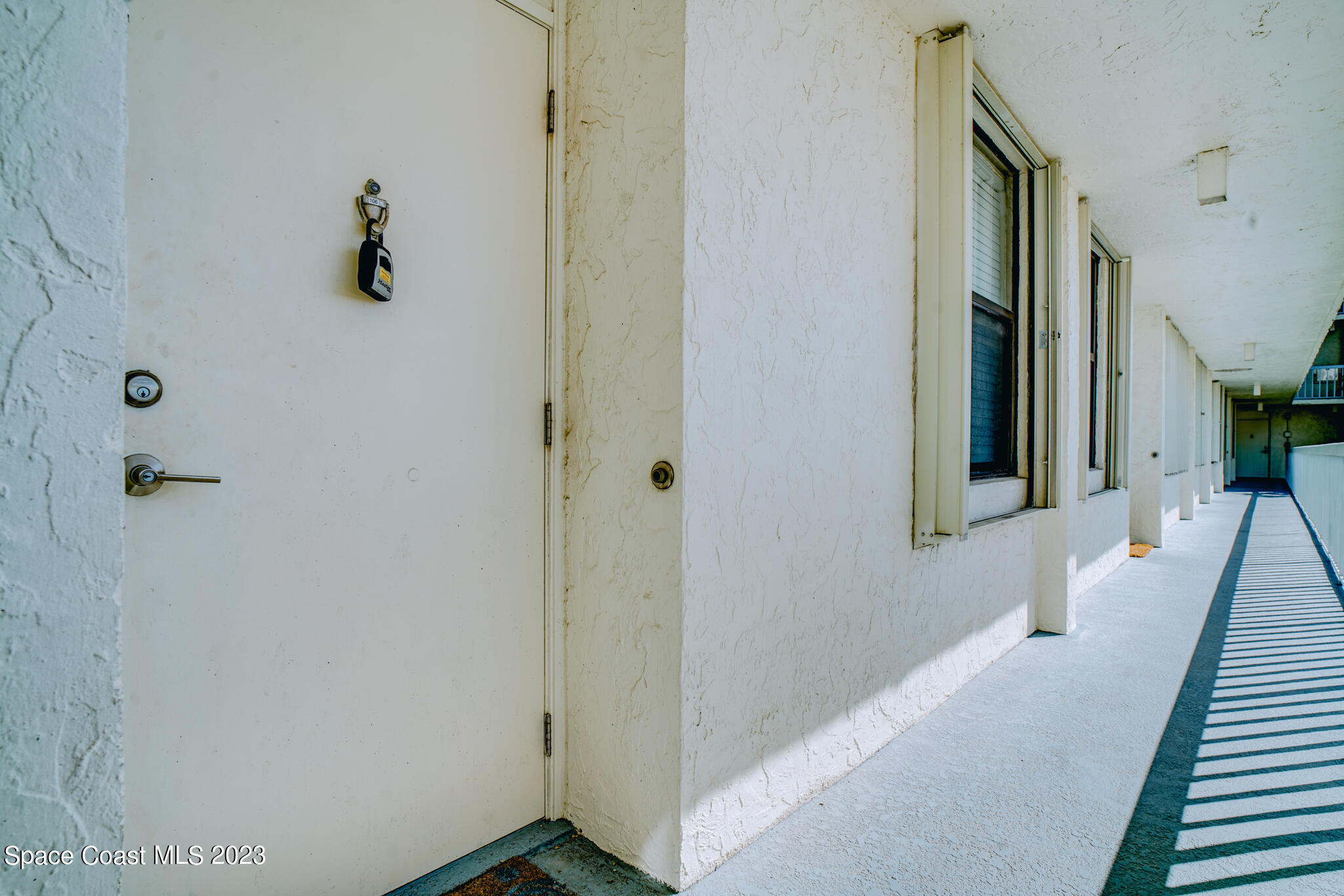 a view of a hallway with entryway door