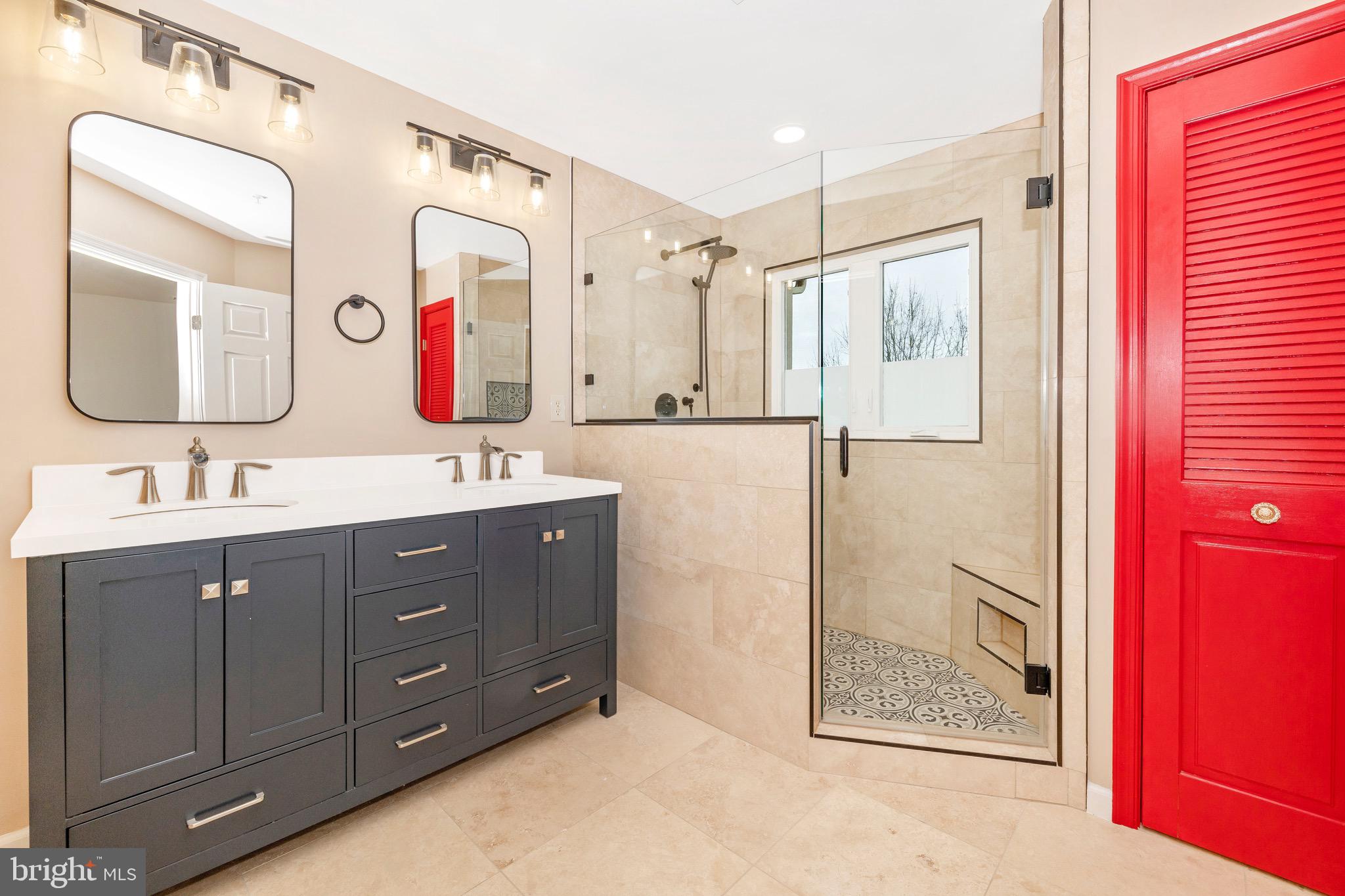 a bathroom with a double vanity sink mirror and double