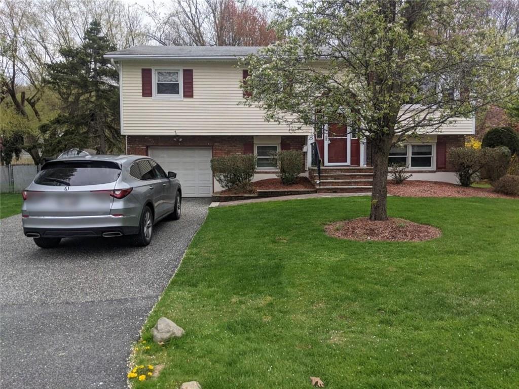 a house view with a sitting space and garden