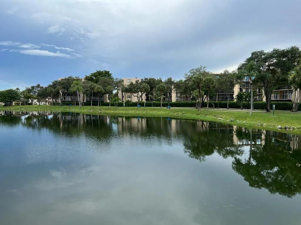 a view of a lake with houses in the back