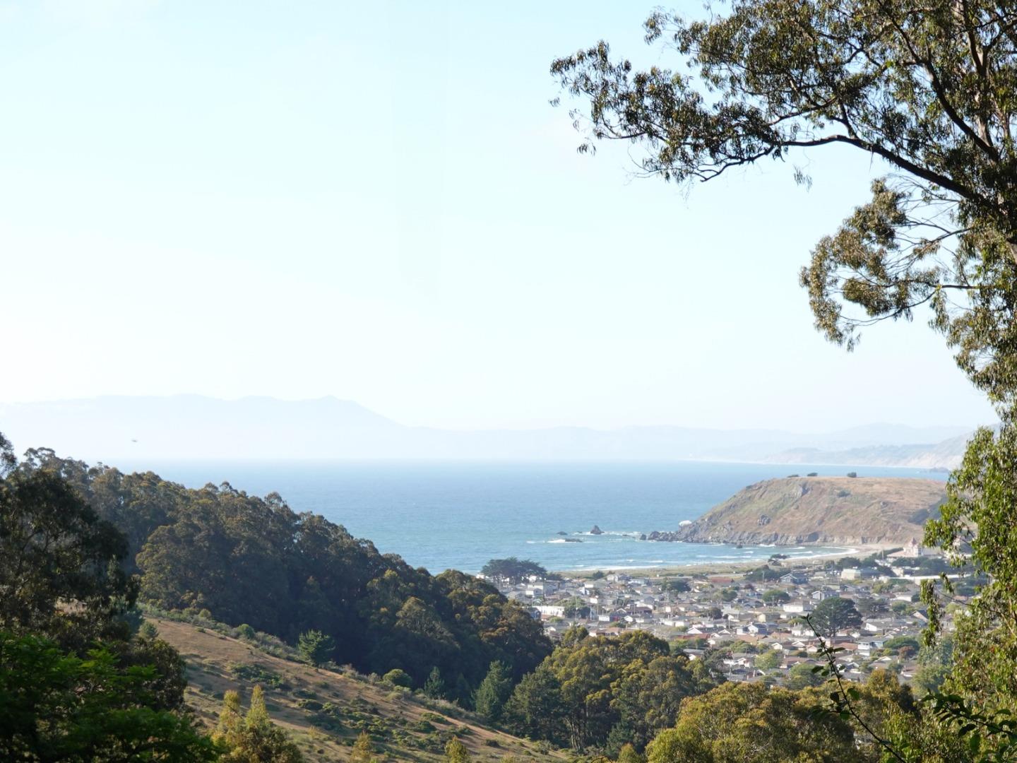 a view of beach and mountain