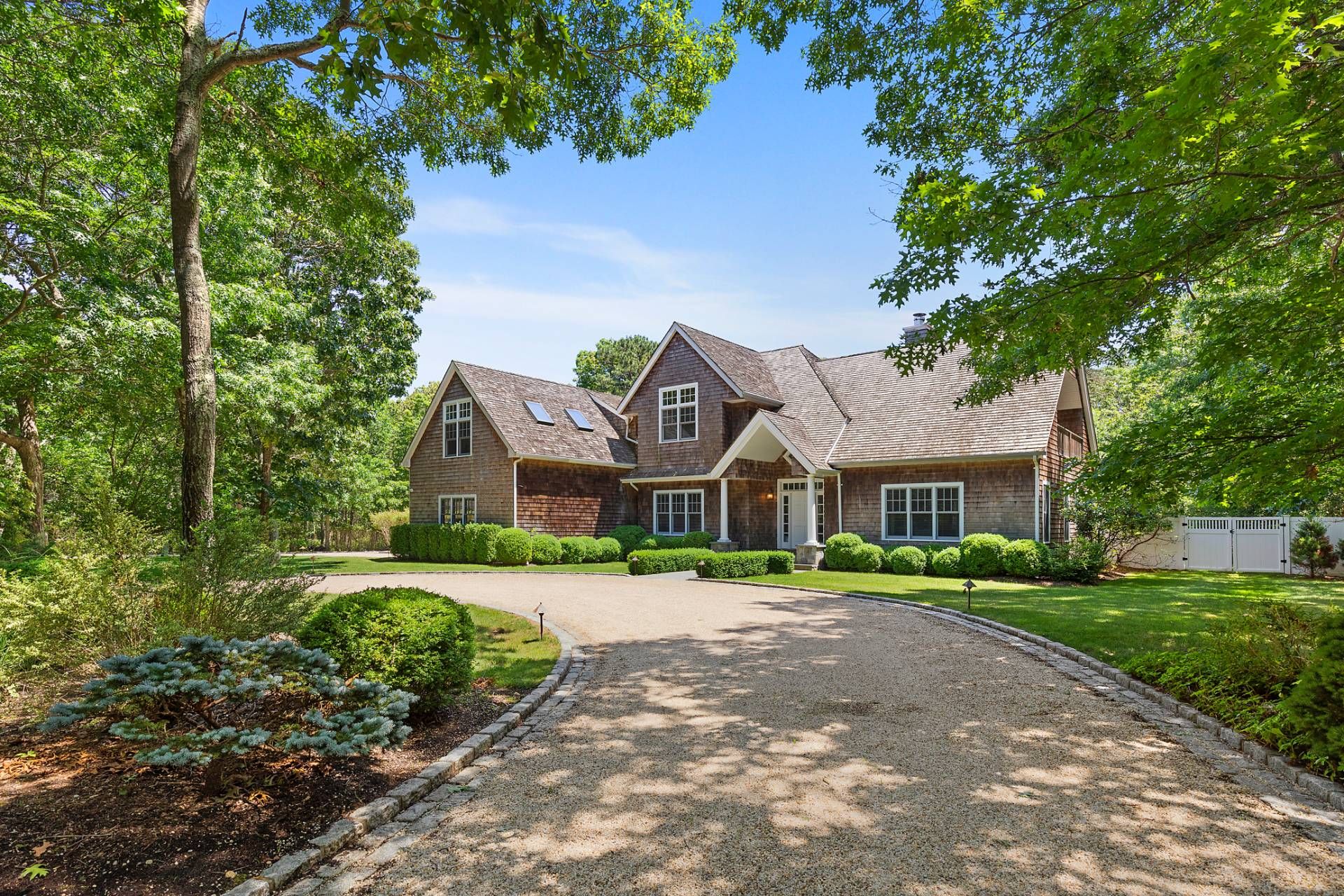 front view of a house next to a yard