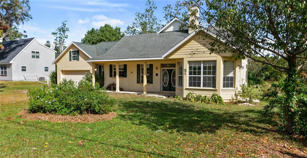 a front view of a house with a yard and porch