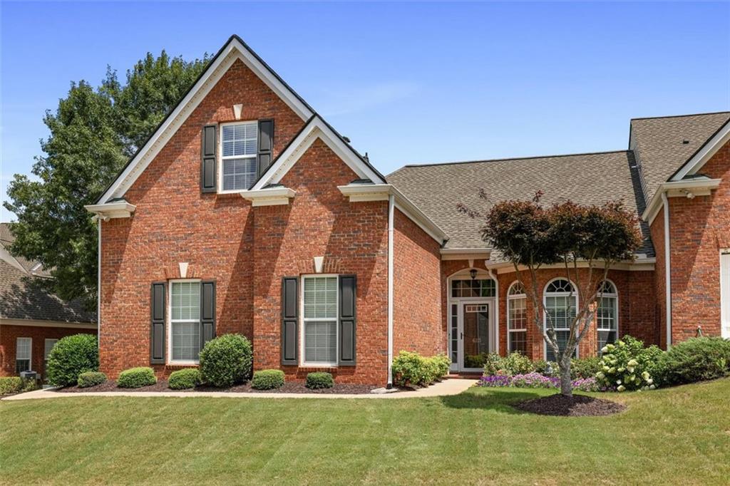 front view of a house with a yard